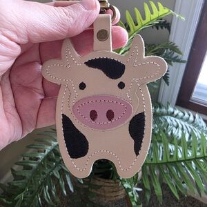 Portland Leather Cow-Shaped Bag Charm in Tan and Black